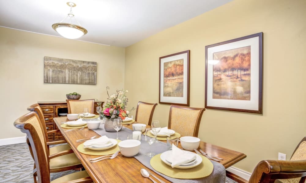 Room with long dining table at Woodside Senior Living in Springfield, Oregon