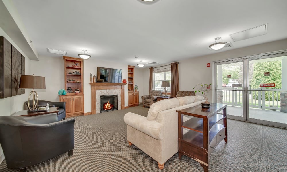 Fireplace lounge with direct access to the outside at Fair Oaks Health Care Center in Crystal Lake, Illinois