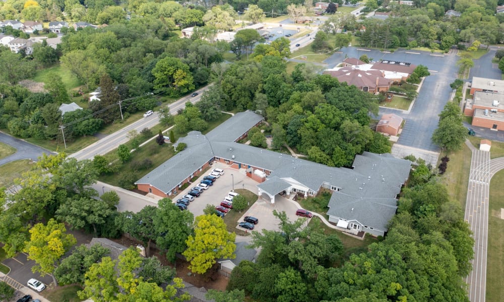 Aerial view of the community and surrounding lush campus at Fair Oaks Health Care Center in Crystal Lake, Illinois