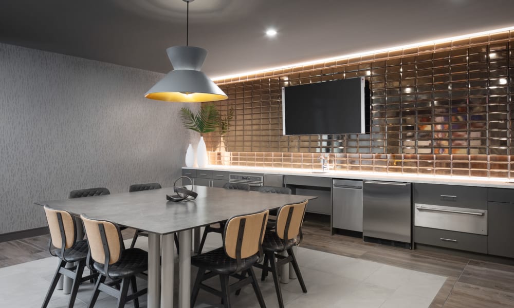 Eating area for residents with modern lighting at Bellrock Sawyer Yards in Houston, Texas