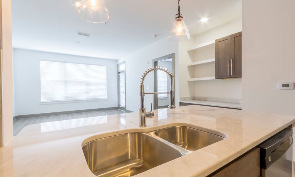 Kitchen with a double sink and island at Block Lofts | Apartments in Atlanta, Georgia