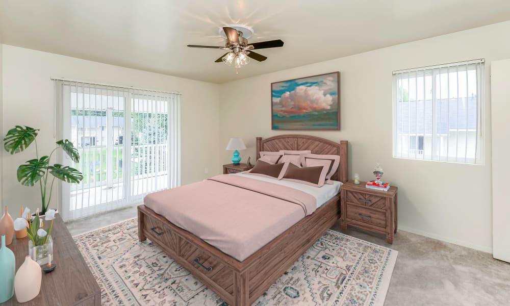 Large model bedroom with a ceiling fan at Greentree Village Townhomes in Lebanon, Pennsylvania