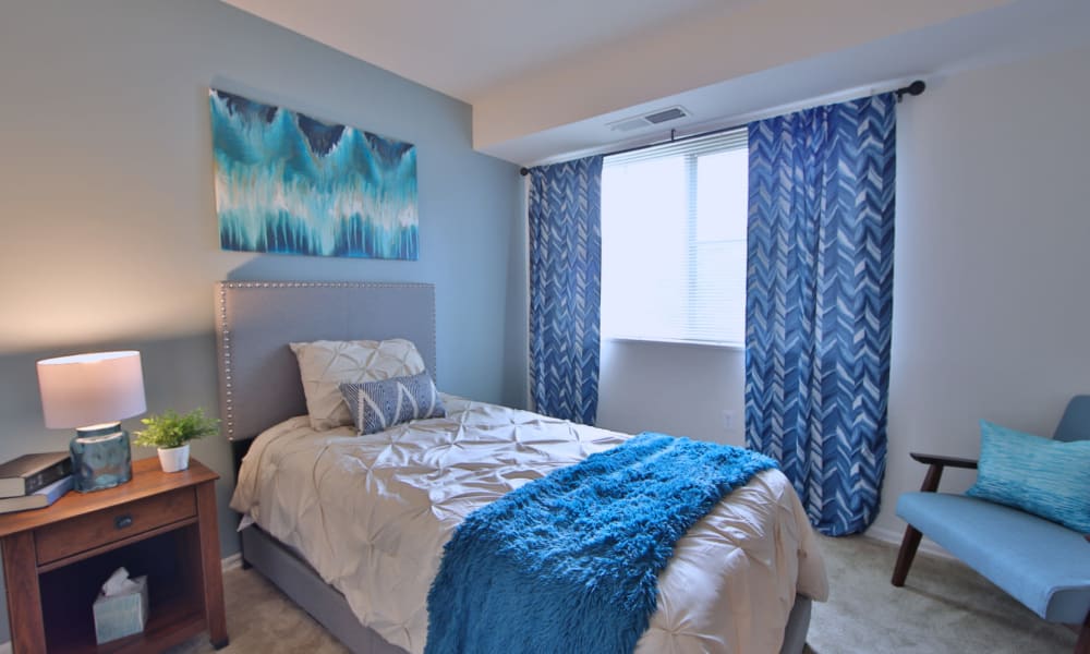 Model bedroom at Steeplechase Apartments in Camillus, New York.