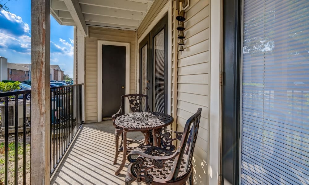 Private outdoor deck at Peppertree Apartment Homes in Lafayette, Louisiana