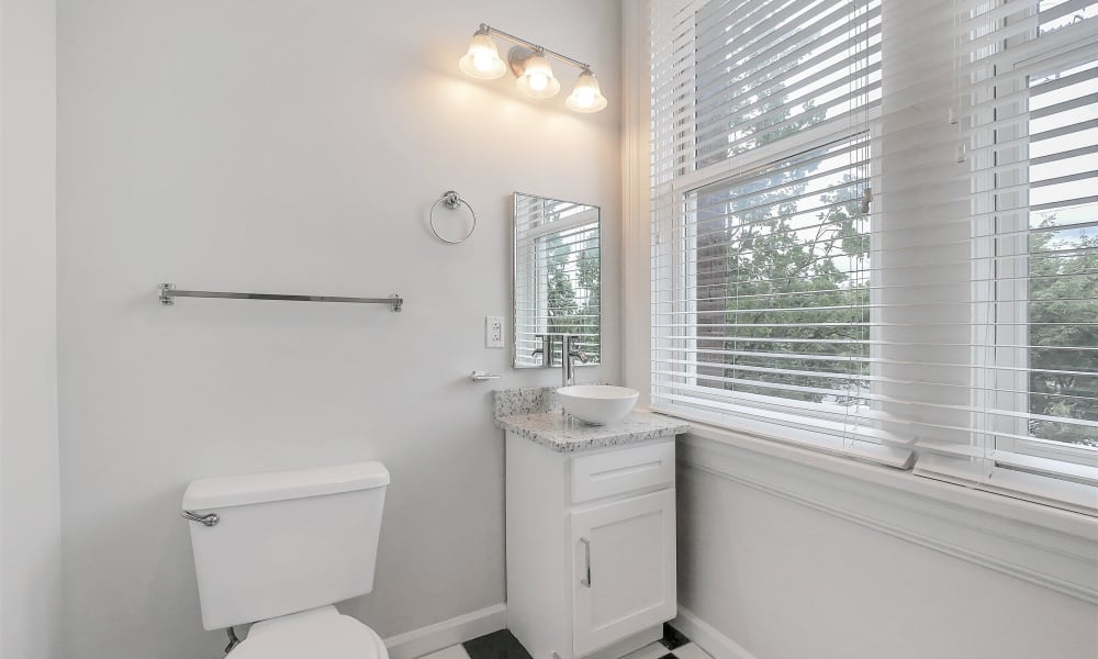 Bathroom with great lighting at The Grand Apartments in Chattanooga, Tennessee