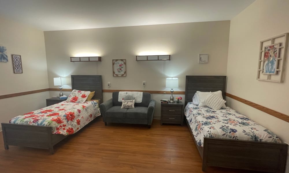 Two twin beds in a room at Belle Reve Senior Living in Milford, Pennsylvania