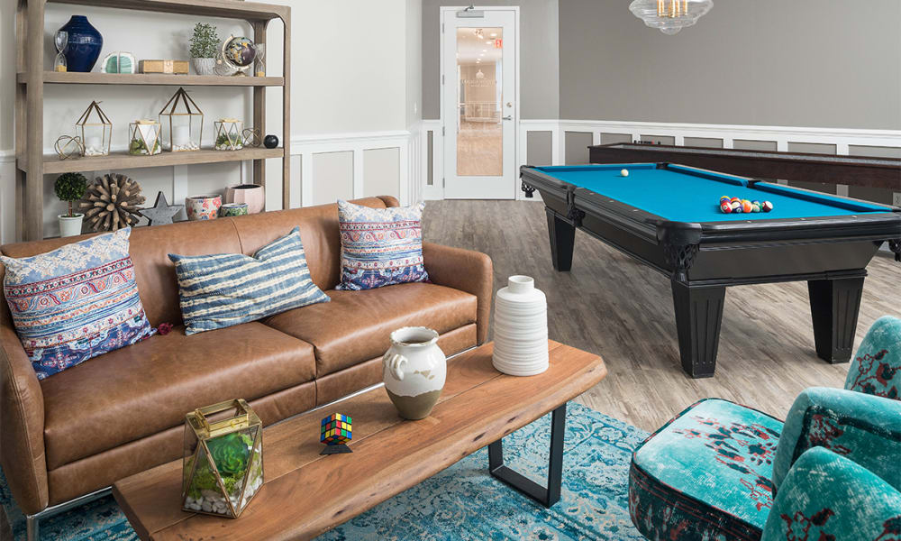 Resident clubhouse with pool table at The Village at Stetson Square in Cincinnati, Ohio