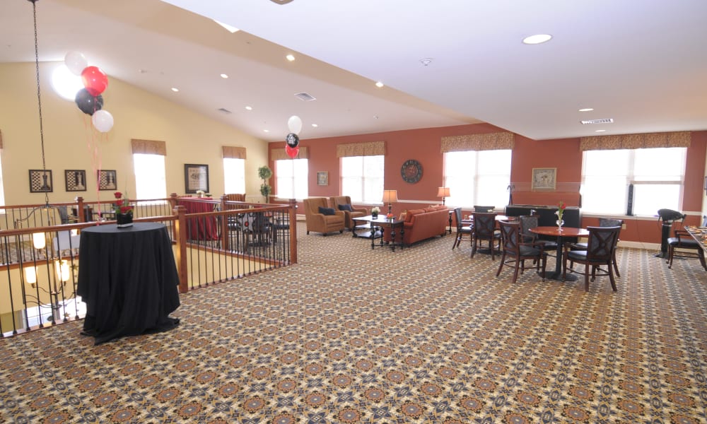 Upstairs activity room with lots of seating and decorated with balloons at The Birches of Lehigh Valley in Easton, Pennsylvania