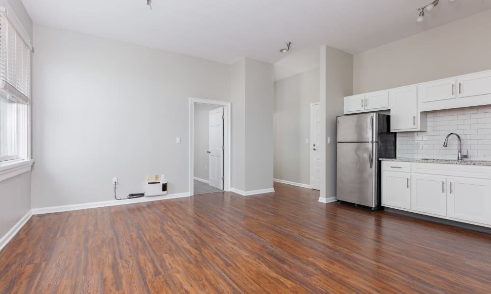 Spacious apartment with wood-style flooring at The Grand Apartments in Chattanooga, Tennessee