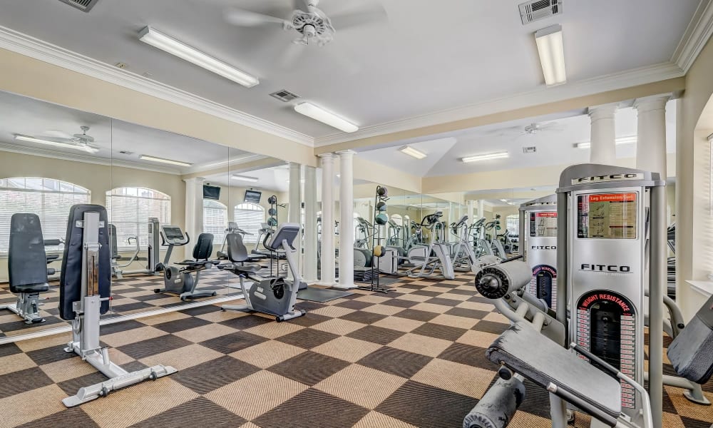 Fitness center equipment at Champion Lake Apartment Homes in Shreveport, Louisiana