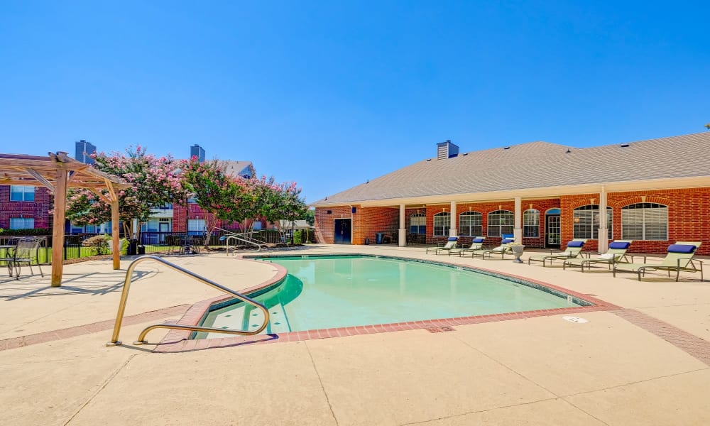 Pool and patio at Champion Lake Apartment Homes in Shreveport, Louisiana