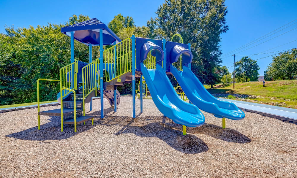 Apartments with a Playground equipped with a slide located at Lakewood Apartment Homes in Salisbury, North Carolina