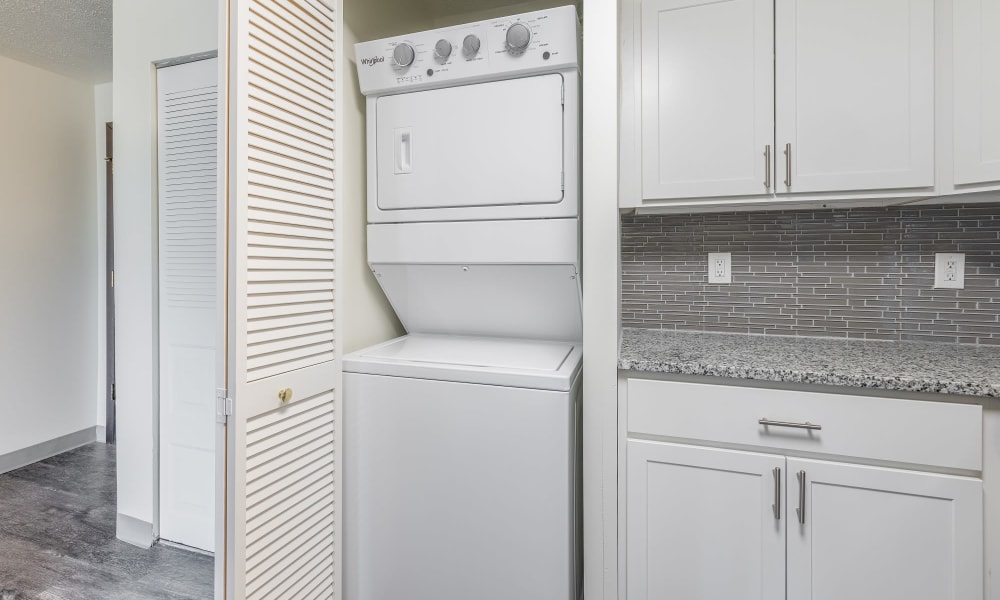 Washer and dryer combo area in apartments with utilities included located at Westpointe Apartments in Pittsburgh,  in Pittsburgh, Pennsylvania