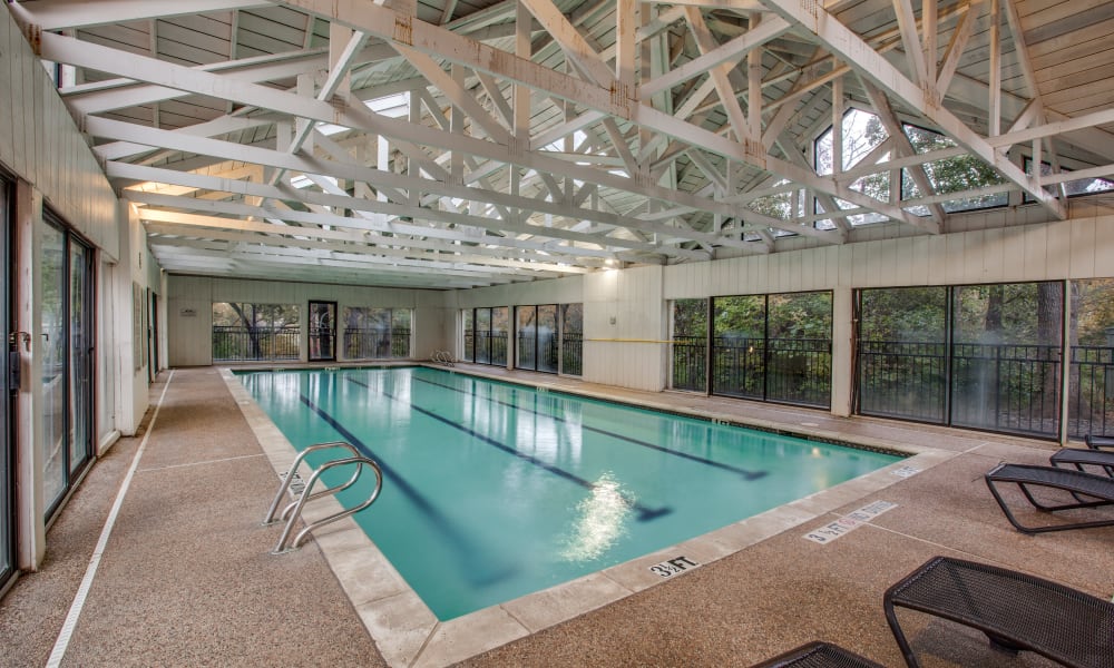 A large indoor swimming pool at Verandahs at Cliffside Apartments in Arlington, Texas