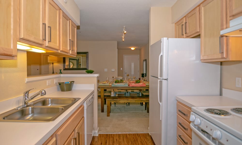 Fully equipped kitchen with white appliances at Arbor Brook in Murfreesboro, Tennessee