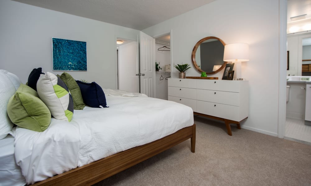 Spacious model bedroom with plush carpeting at Briar Cove Terrace Apartments in Ann Arbor, Michigan