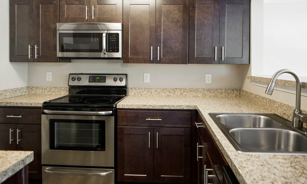 An apartment kitchen with new appliances at Timberlawn Crescent in North Bethesda, Maryland