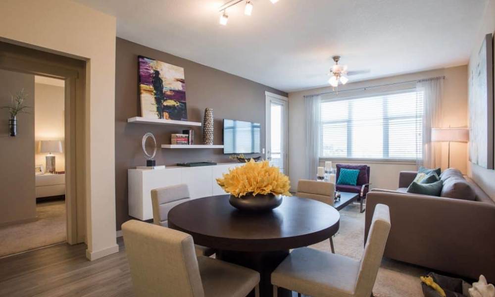 Living room with wooden flooring, large windows at Elevation @ County Line Station in Englewood, Colorado