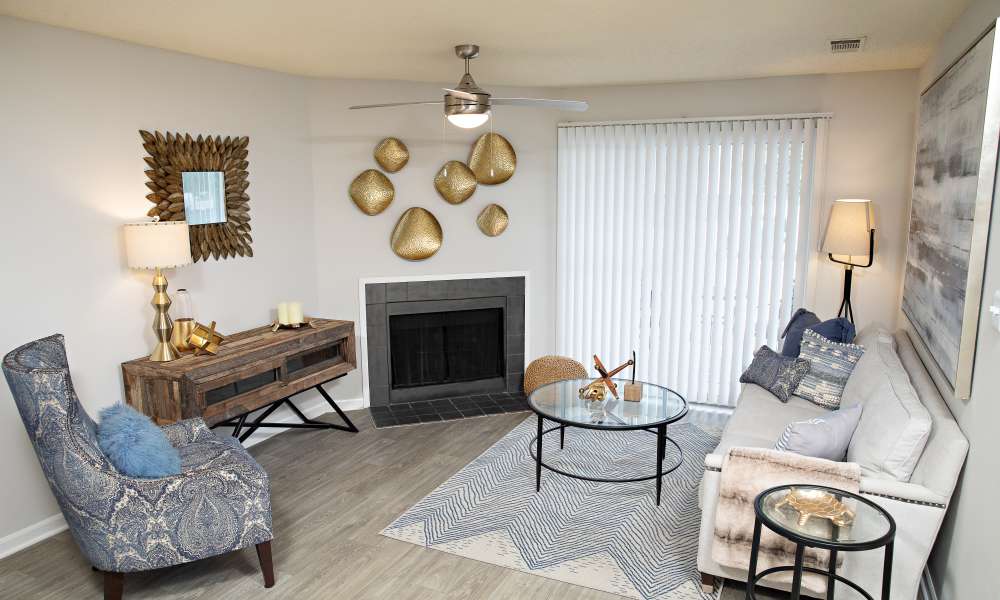 A furnished apartment living room with a fireplace at Nine Two Six West in Augusta, Georgia