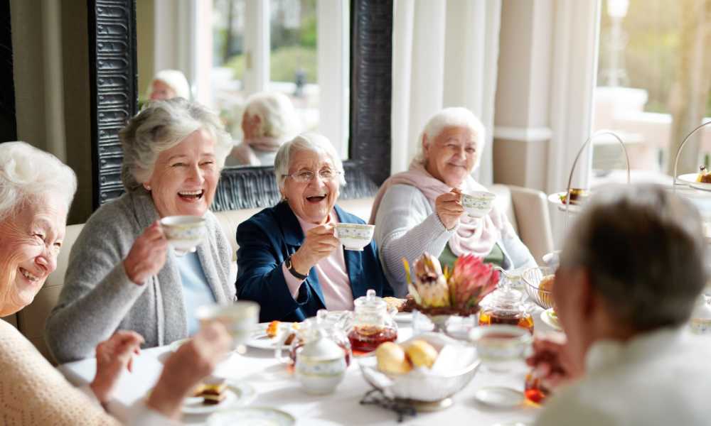 Group of residents enjoying tea at Clearwater at The Heights in Houston, Texas