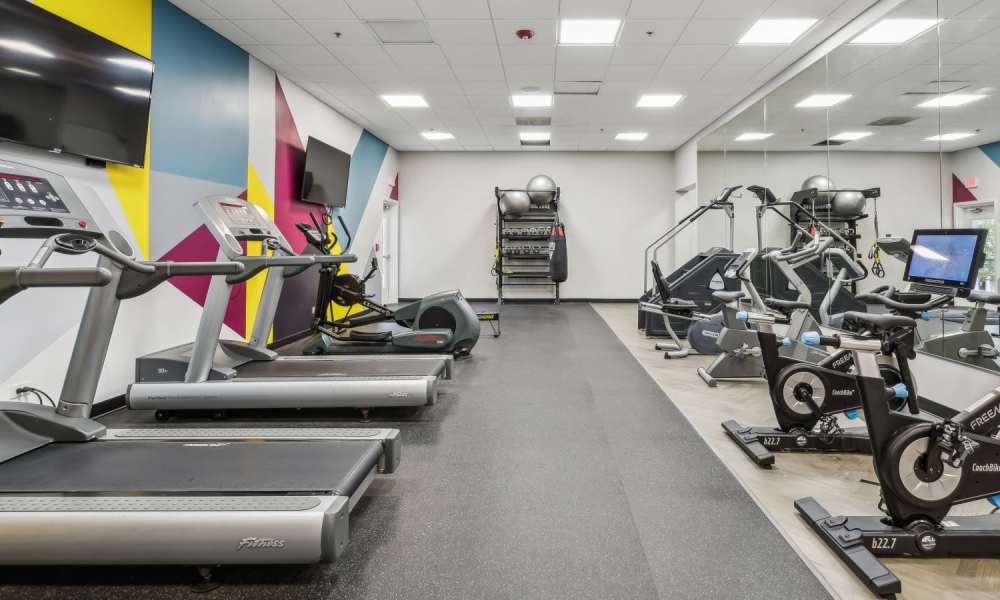 Fitness center with cardio equipment at Hawthorn at Oakhurst in Aurora, Illinois