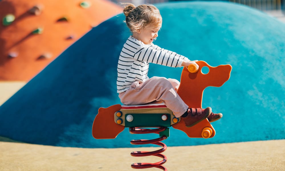 Child playing at a park near Sorella in Denver, Colorado