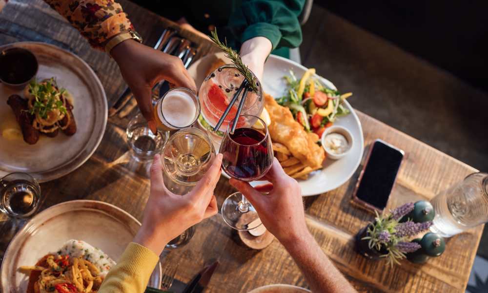 Friends enjoying a meal at a restaurant near Altura in Phoenix, Arizona