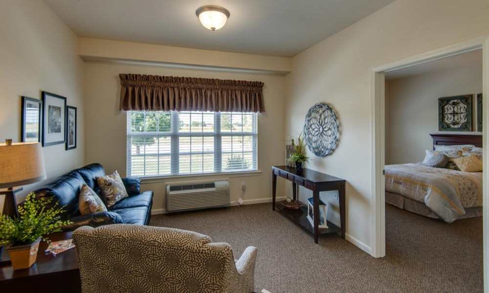 Resident living room and bedroom at Centennial Pointe Senior Living in Springfield, Illinois