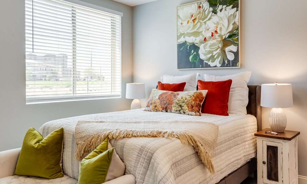 Bedroom with side lamp at Pine Grove Crossing in Parker, Colorado