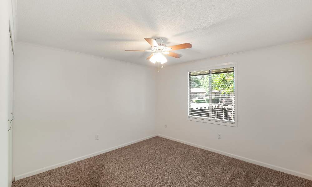 Bedroom with ceiling fan at The Flats at Lakeshore in Fort Oglethorpe, Georgia