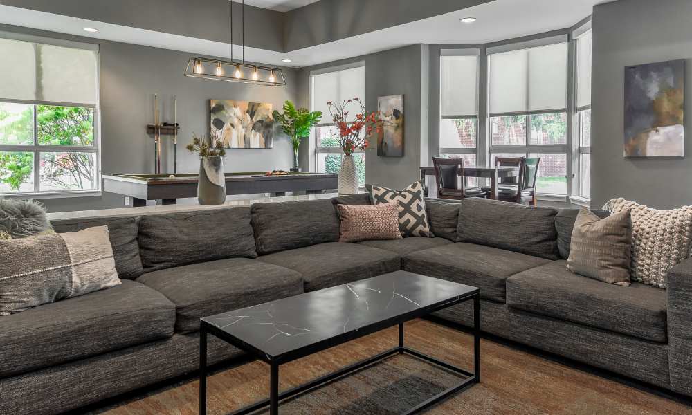 Community house with couch at The Pointe at St. Joseph Apartment Homes in South Bend, Indiana