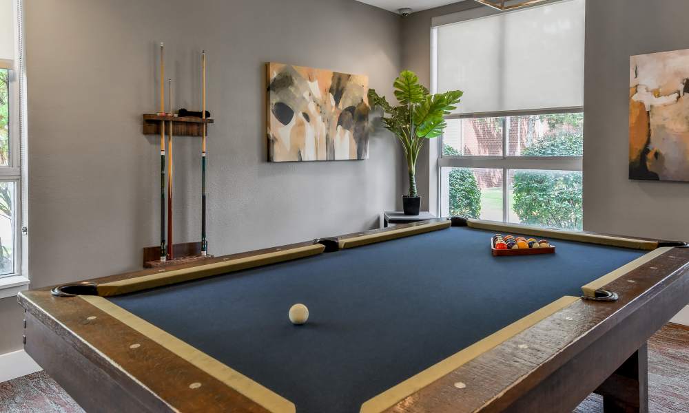 Billiard table in game room at The Pointe at St. Joseph Apartment Homes in South Bend, Indiana