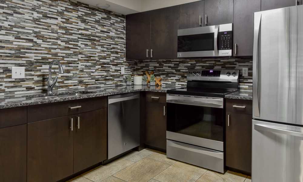 Kitchen with backsplash at The Pointe at St. Joseph Apartment Homes in South Bend, Indiana