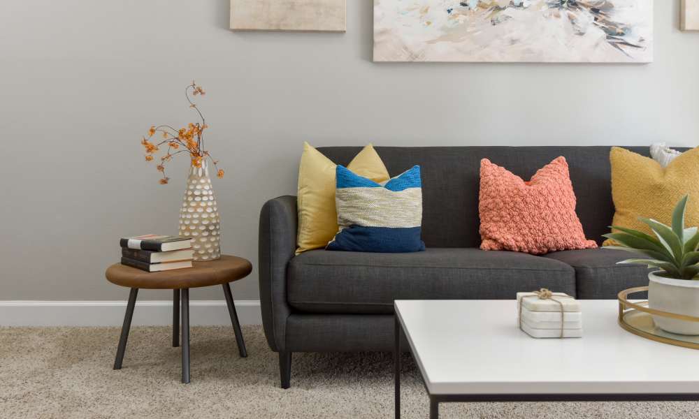 Couch with side table at The Pointe at St. Joseph Apartment Homes in South Bend, Indiana