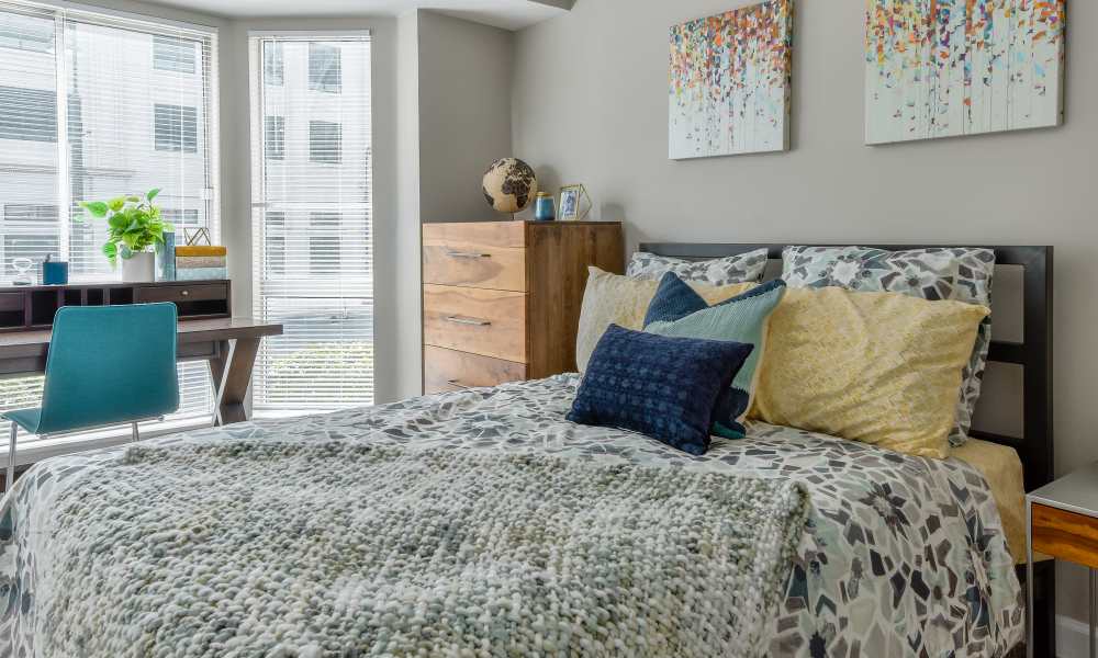 Bedroom with study table at The Pointe at St. Joseph Apartment Homes in South Bend, Indiana
