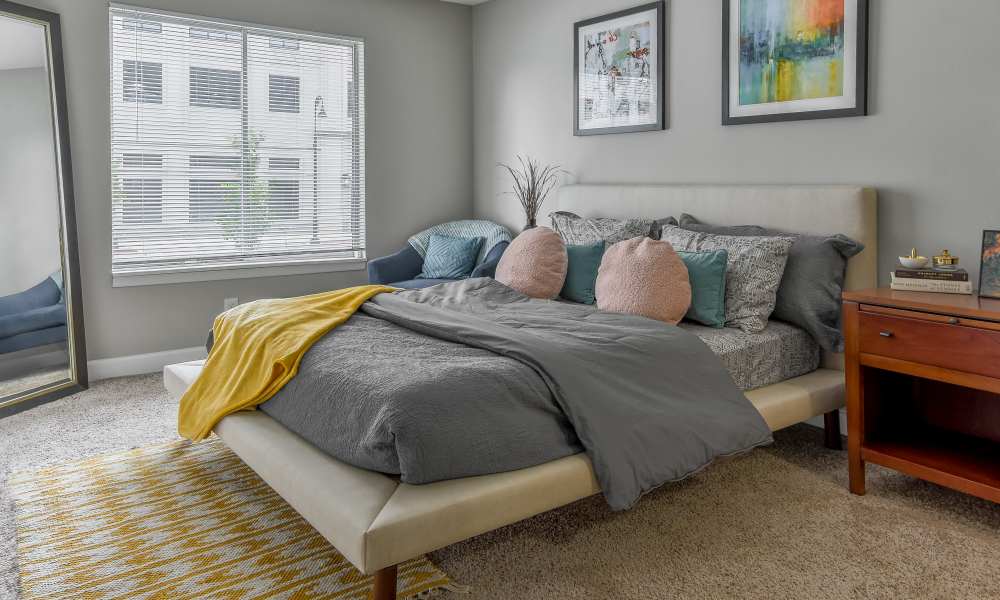 Cozy bedroom at The Pointe at St. Joseph Apartment Homes in South Bend, Indiana