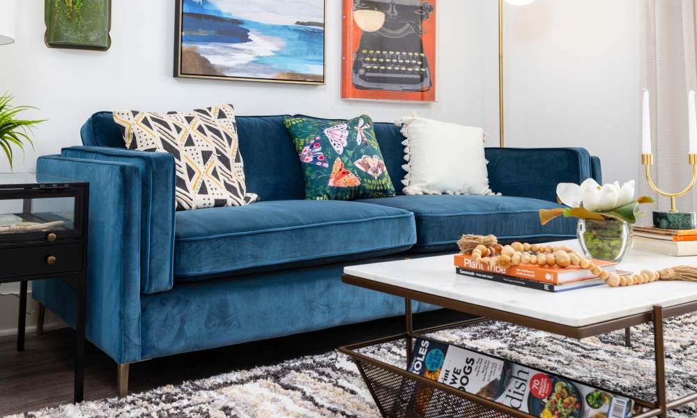 A cozy couch in a model home's living room at The Lowe in Savannah, Georgia