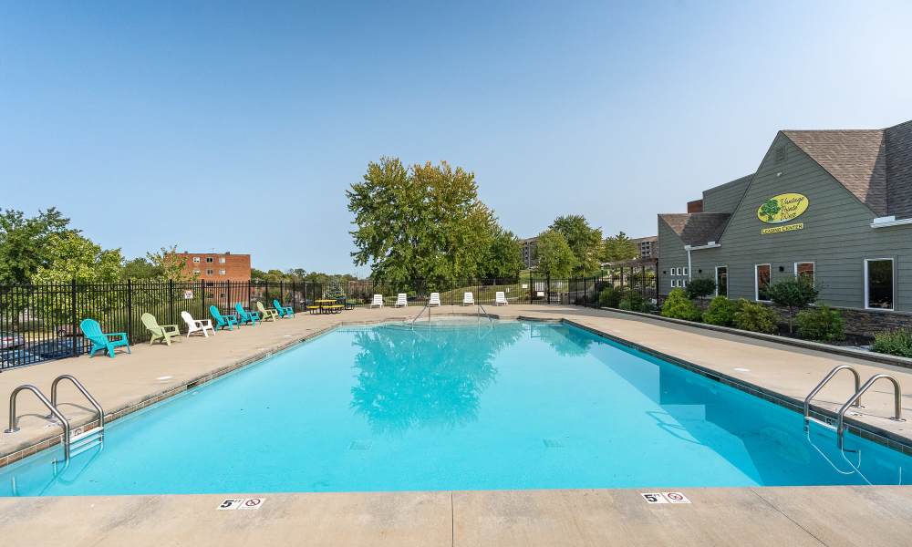 Resort-style swimming pool with multiple lounge chairs at Vantage Pointe West Apartment Homes in Cincinnati, Ohio
