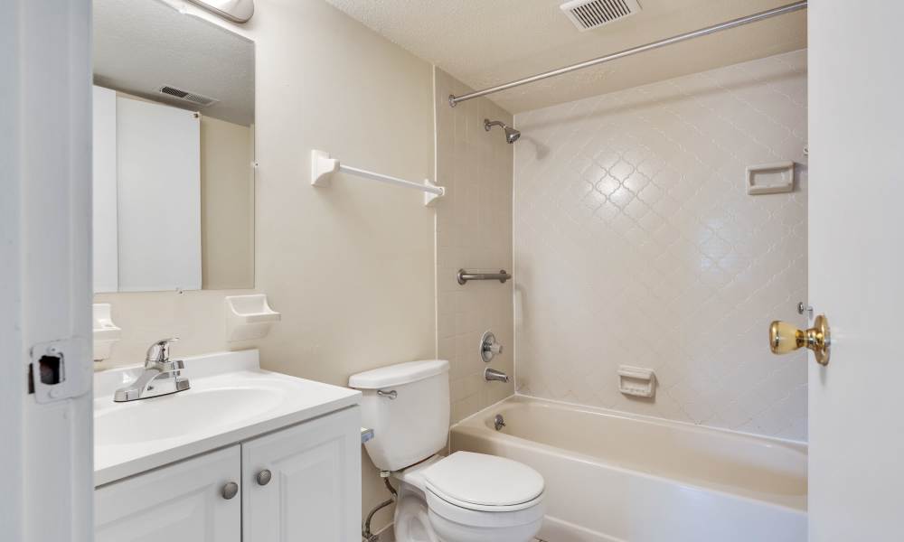 Bathroom with a toilet, bathtub and a shower at Vantage Pointe West Apartment Homes in Cincinnati, Ohio
