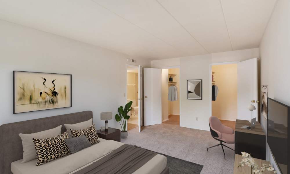 Spacious bedroom with a door leading to the bathroom at Vantage Pointe West Apartment Homes in Cincinnati, Ohio