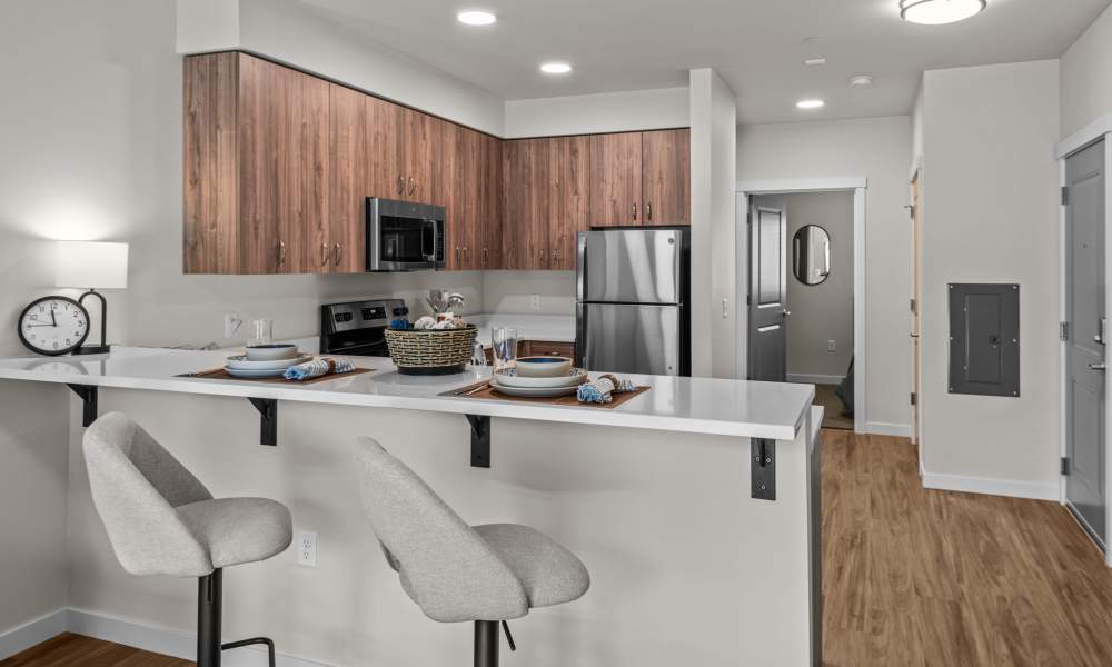 Subway tile backsplash and modern appliances in a model home's kitchen at Peak 42 in Bend, Oregon         