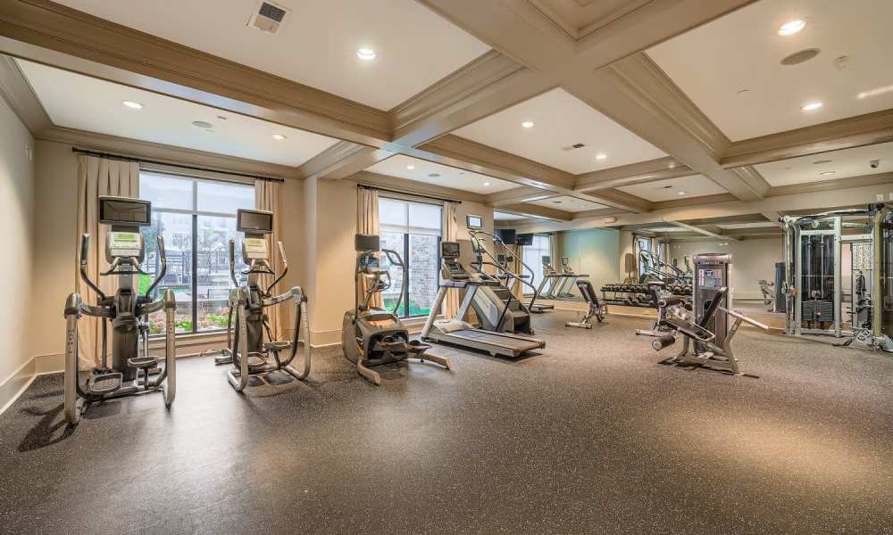 Fitness center with treadmills and weight machine at 2370 Main at Sugarloaf in Duluth, Georgia 
