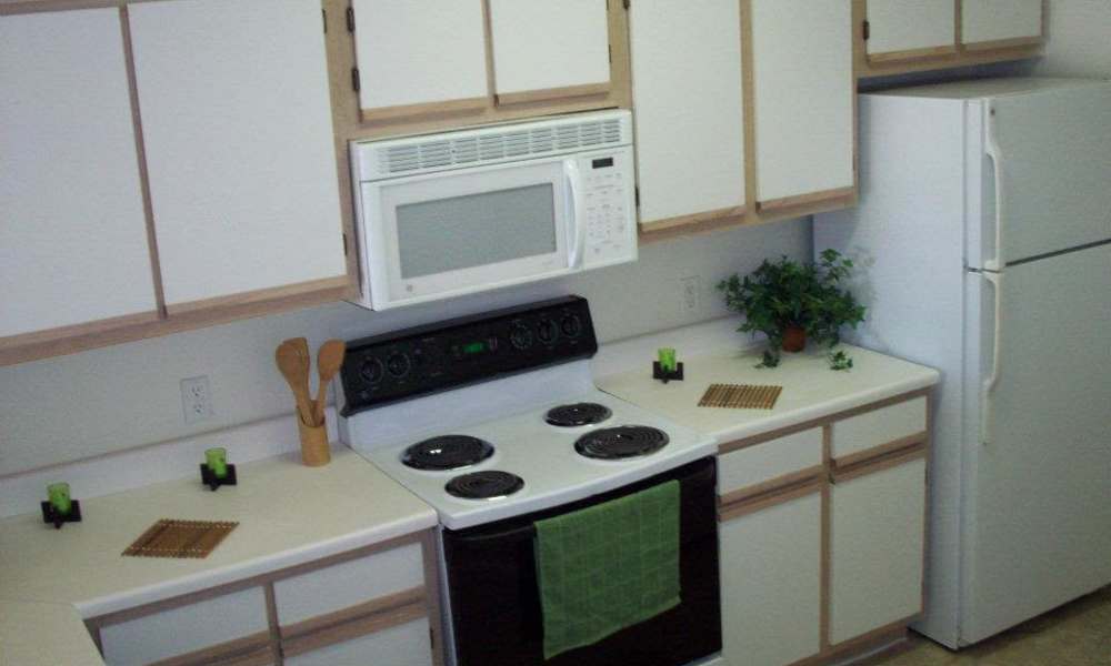 Couple enjoying an afternoon walk by a lake near Fairmont Oaks Apartments in La Porte, Texas