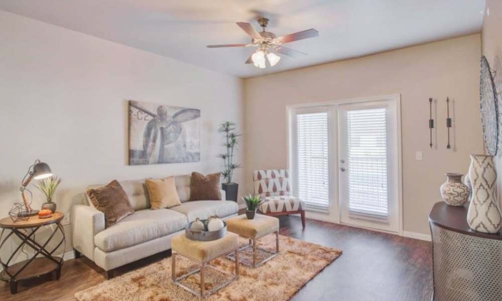 Living room with sliding glass door at Vistas at Red Creek in , Texas