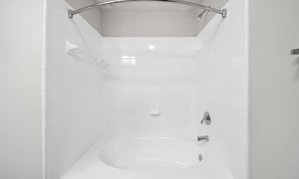 Shower and bathtub combo in bathroom at Sunset Lodge in Odessa, Texas