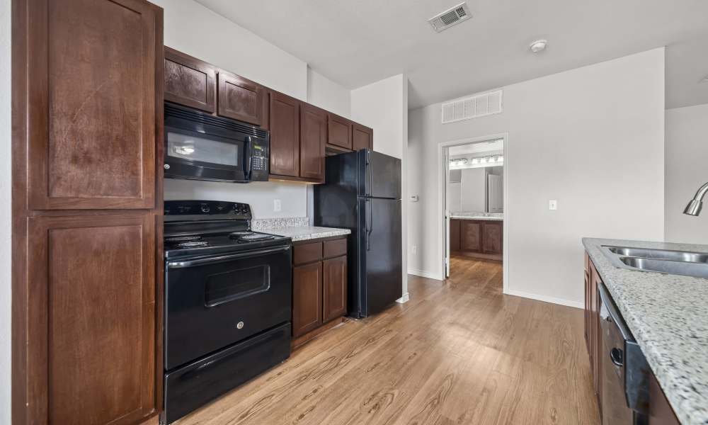 An apartment kitchen at Sunset Lodge in Odessa, Texas