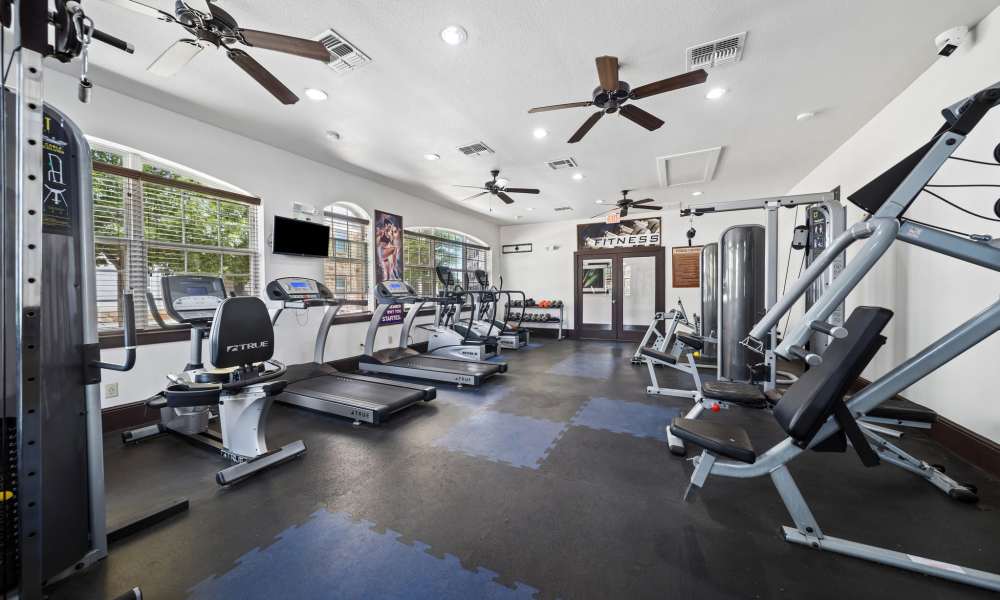 Modern fitness center with cardio equipment at Sunset Lodge in Odessa, Texas