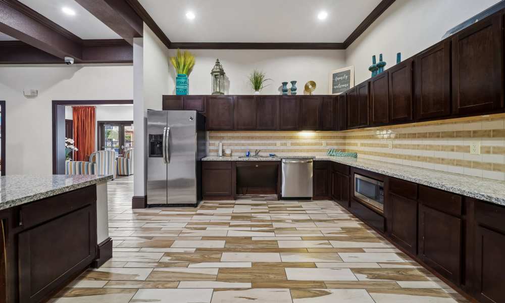 Resident clubhouse kitchen featuring stainless steel appliances at Sunset Lodge in Odessa, Texas