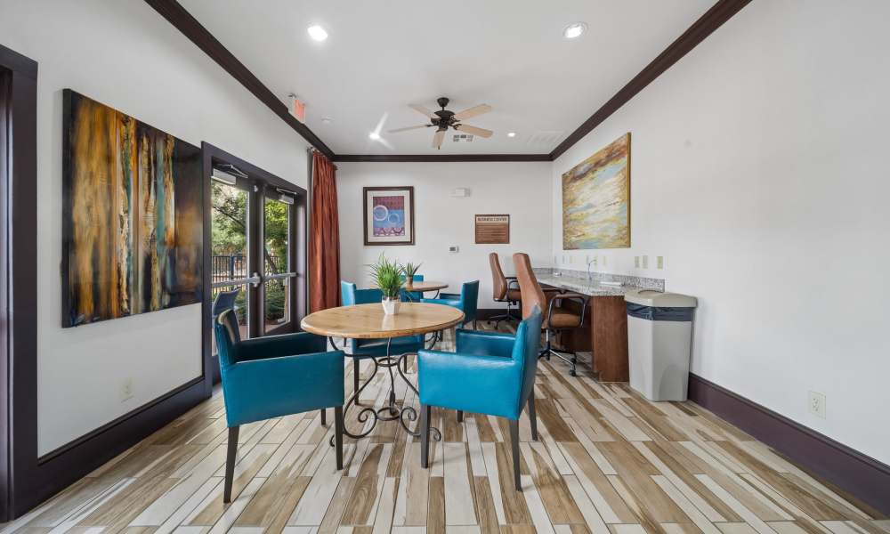 Table and chairs in business center at Sunset Lodge in Odessa, Texas