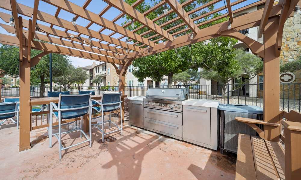 Barbeque grill beside pool at Sunset Lodge in Odessa, Texas